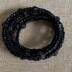 Black memory wire snake bracelet. Goth or dark academia.